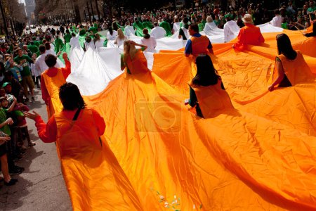 Photo for Human Flag Of Ireland Navigates Through Atlanta St. Patrick's Parade - Royalty Free Image