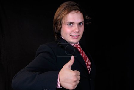 Photo for Young man showing thumb up - Royalty Free Image