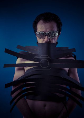 Photo for Bdsm, man covered with black strips, shibari concept art - Royalty Free Image