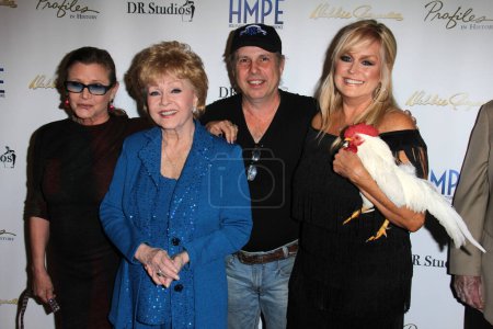 Foto de Carrie Fisher, Debbie Reynolds, Todd Fisher, Catherine Hickland at Debbie Reynolds - The Auction Finale Preview Night by Profiles In History with auction to take place on May 17 and 18, Debbie Reynolds Dance Studios, North Hollywood, CA - Imagen libre de derechos