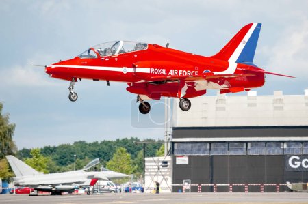 Photo for Red Arrows closeup. Airplane ready for flight at daytime - Royalty Free Image