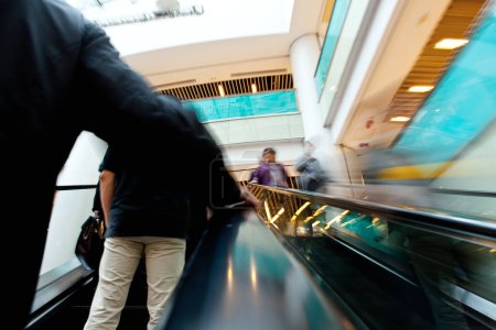Photo for People on the moving escalator - Royalty Free Image
