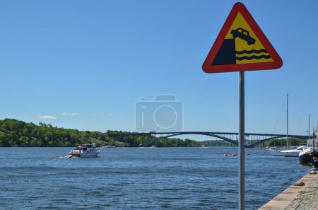 Photo for Warning for quayside on river shore - Royalty Free Image