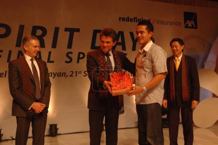 Photo for AXA CEO-Henri de Castries receiving gift from AXA indonesia - Royalty Free Image