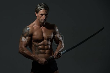 Photo for Strong Man With Samurai Sword - Royalty Free Image