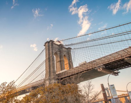 Photo for The Brooklyn Bridge at sunset as seen from Brooklyn street - Royalty Free Image