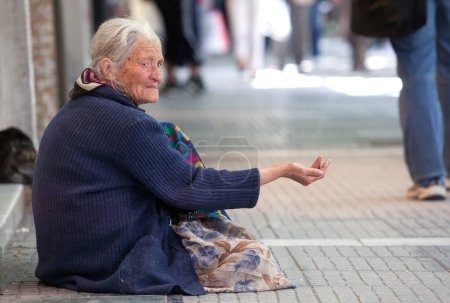 Photo for Beggar on city street in Europe - Royalty Free Image