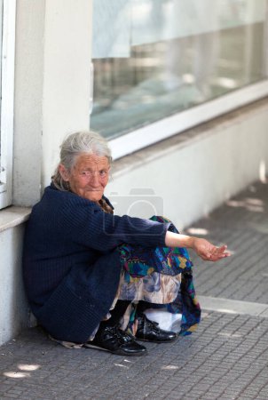 Photo for Beggar on city street in Europe - Royalty Free Image
