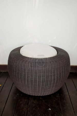Photo for A modern design of rattan stool with white cushion - Royalty Free Image