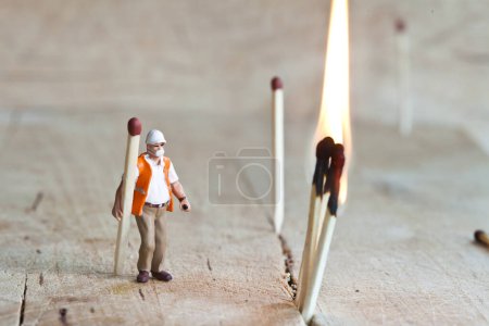 Photo for Miniature people in action with matchsticks - Royalty Free Image