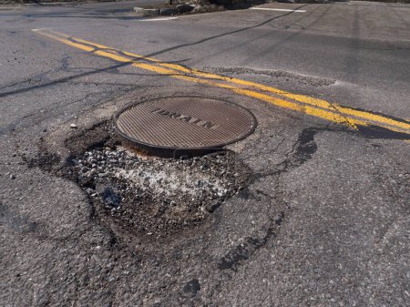 Photo for Big pothole in road, close up view - Royalty Free Image