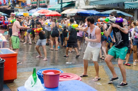 Photo for Bangkok, Thailand - April 15, 2014: Songkran festival, the traditional Thai New Year, on Khao San Road in Bangkok, Thailand. - Royalty Free Image