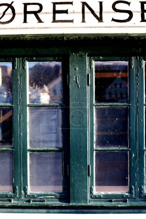 Photo for Green Shop Window With Flaking Paint Old Town Stavanger Norway - Royalty Free Image