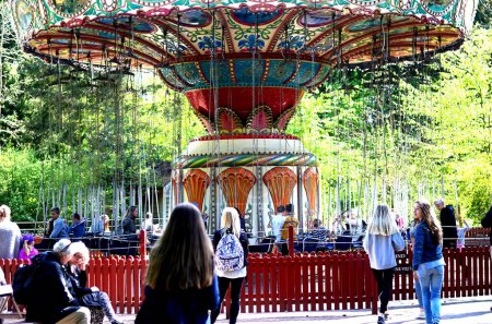 Photo for Carousel in sunny amusement park - Royalty Free Image