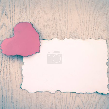Photo for Heart and white paper on wooden table background - Royalty Free Image