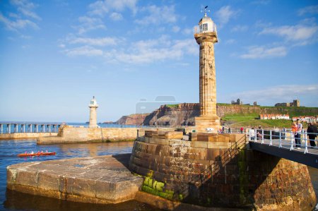 Photo for Whitby North Yorkshire pier with Lighthouse - Royalty Free Image