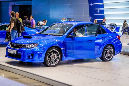 Photo for "MOSCOW, RUSSIA - AUG 2012: SUBARU WRX STI 3RD GENERATION presented as world premiere at the 16th MIAS Moscow International Automobile Salon on August 30, 2012 in Moscow, Russia" - Royalty Free Image