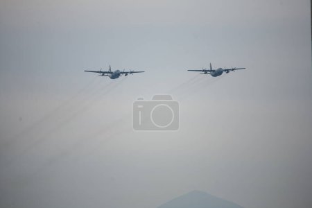 Photo for Chile, Santiago: Military planes of the Chilean Air Force flew over Santiago in formation to celebrate the Day of the Glories of the Army, on September 19, 2015. - Royalty Free Image