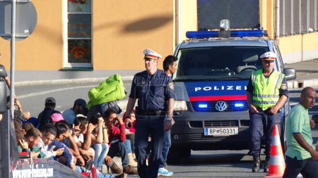Photo for GERMANY, Freilassing: Refugees being stopped by police as they enter Germany from Austria at Freilassing train station, on September 21, 2015. The station has become a huge processing camp for migrants heading to Germany, following border controls - Royalty Free Image