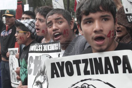 Photo for Mexico, Morelia: Hundreds of people march during a rally marking the one year anniversary since the disappearance of the 43 Ayotzinapa students, in Morelia, Mexico, 26 September 2015 - Royalty Free Image