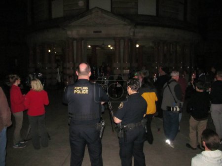 Photo for US, Portland: Religious leaders, police and locals attended a vigil outside Portland City Hall on September 1, 2015, following a mass shooting at Umpqua Community College, Roseburg. - Royalty Free Image