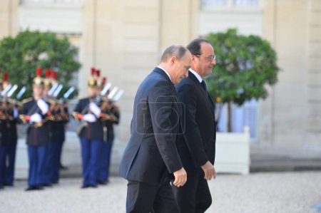 Photo for FRANCE, Paris: French President Franois Hollande welcomes Russian President Vladimir Putin  before Normandy Four summit on Ukraine and Syria at Elyse Palace, the French presidential residence, on October 2nd, 2015. - Royalty Free Image