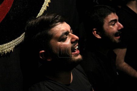 Photo for IRAN, Tehran: Hundreds of shirtless Shia Muslims in Reyhane-Al-Hossein complex building attend mourning session in tribute to imam Husayn ibn Ali on October 21, 2015, the 8th night of Muharram in Tehran, Iran. - Royalty Free Image