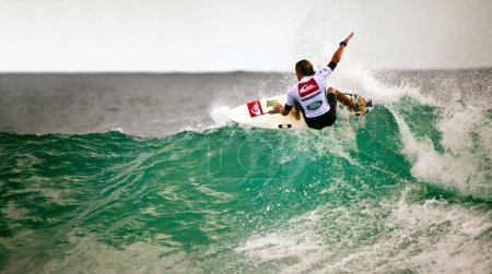 Photo for Surfer races Quiksilver and Roxy Pro World Title Event, 2012 - Royalty Free Image