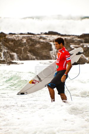 Photo for Surfer races Quiksilver and Roxy Pro World Title Event, 2012 - Royalty Free Image