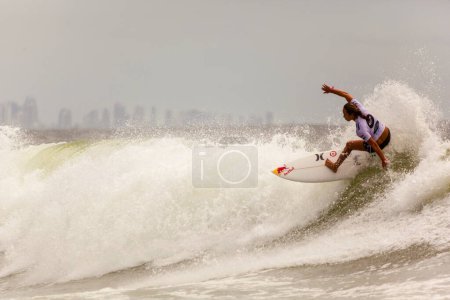 Photo for Surfer races Quicksilver and Roxy Pro World Title Event - Royalty Free Image