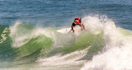 Photo for Professional female surfer compete on the Burleigh Pro 2013 - Royalty Free Image