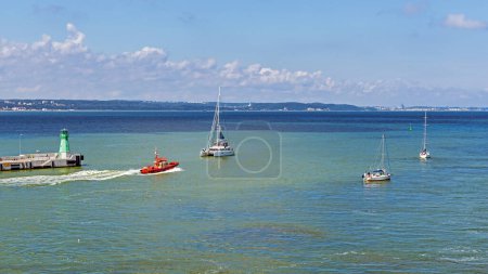 Photo for Tugboat and sailboats in sea - Royalty Free Image