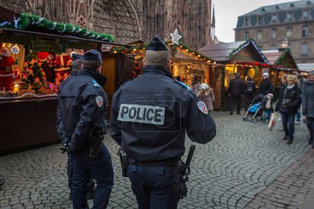Photo for FRANCE, Strasbourg : French policemen patrol in the Christmas market area in Strasbourg, eastern France, on November 27, 2015, on its opening day. - Royalty Free Image