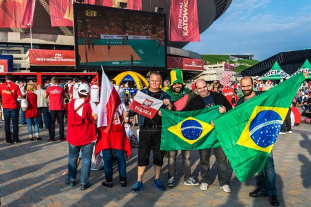 Photo for Polish and Brazilian fans watch Brazil vs France match on the screen in the fanzone at Spodek Arena in Katowice during FIVB Volleyball Men's World Championship Poland 2014. - Royalty Free Image
