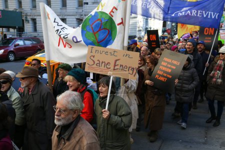 Photo for UNITED STATES, New York - November 29, 2015: Hundreds of protesters urge world leaders to take a stronger stance on climate change at a march in New York City - Royalty Free Image