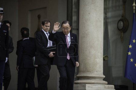 Photo for FRANCE, Paris : Secretary-General of the United Nations Ban Ki-moon leaves following a meeting with the French President on November 29, 2015 at the Elysee palace in Paris. - Royalty Free Image