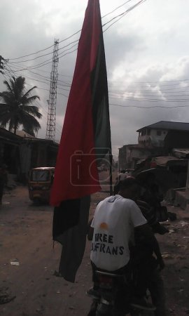 Photo for NIGERIA, Aba: Biafra supporters rallied in Aba, Nigeria on December 1, 2015 against the continued detention of Radio Biafra boss and leading member of the Indigenous People of Biafra (IPOB) Mazi Nnamdi Kanu. - Royalty Free Image