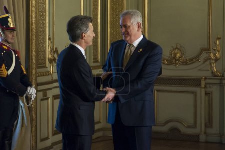 Photo for ARGENTINA, Buenos Aires: Argentine President-elect Mauricio Macri (left) smiles and shakes hands at his inauguration ceremony at Argentine National Congress in Buenos Aires on December 10, 2015. - Royalty Free Image
