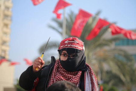 Photo for GAZA STRIP, Gaza : Hundreds of Palestinians rally to mark the 48th anniversary of the establishment of the Popular Front for the Liberation of Palestine (PFLP) in Gaza City, on December 12, 2015 - Royalty Free Image