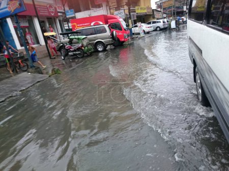 Photo for PHILIPPINES, Mandaluyong: Heavy rains hit the Boni avenue in Mandaluyong City, Metro Manila, in Philippines, on December 15, 2015, after the passing of Melor typhoon. - Royalty Free Image