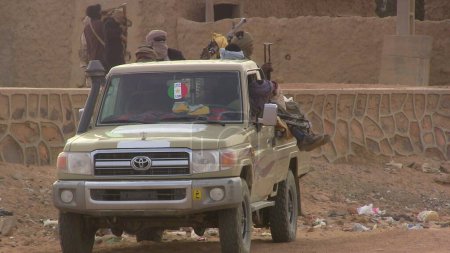 Photo for MALI, Kidal: Soldiers of rebel Coordination of Azawad Movements CMA patrol at the entrance of Kidal, northern Mali, on December 23, 2015 - Royalty Free Image