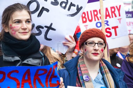 Photo for UK, London: Thousands of junior nurses and their supporters march through London on January 9, 2015 in response to Chancellor George Osborne's plan to replace bursaries with student loans. - Royalty Free Image
