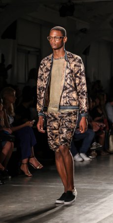 Photo for African American model man walking on podium. Custo Barcelona Fashion show, New York Fashion Week Spring Summer 2016 - Royalty Free Image