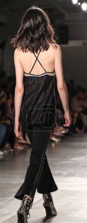 Photo for Custo Barcelona show, New York Fashion Week Spring Summer 2016. brunette woman on podium showing new clothes collection - Royalty Free Image