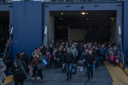 Photo for GREECE, Piraeus: Migrants disembarked in Piraeus, Greece on January 31, 2016. - Royalty Free Image