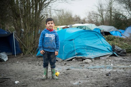 Photo for FRANCE, Grande-Synthe: Child at migrants camp in Grande-Synthe, northern France on February 5, 2016 - Royalty Free Image