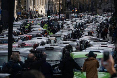 Photo for ENGLAND, London: Taxi cabs block the streets of London during a demonstration against Uber, on February 10, 2016. - Royalty Free Image