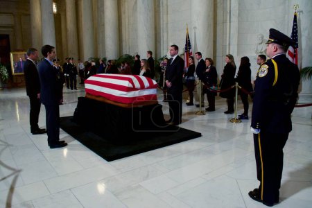 Photo for USA, Washington DC: A man pays his respects to Supreme Court Justice Antonin Scalia, who lies in repose as others wait in line at the nation's highest court in Washington DC on February 19, 2016 - Royalty Free Image