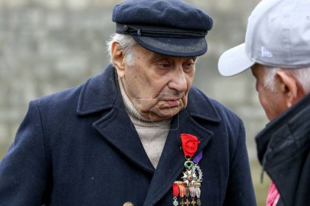 Photo for FRANCE, Ivry-sur-Seine: French militant of Armenian descent Arsne Tchakarian, the last survivor of the World War II Missak Manouchian French resistant group, stands at the military cemetery of Ivry-sur-Seine, on February 21, 2016 - Royalty Free Image