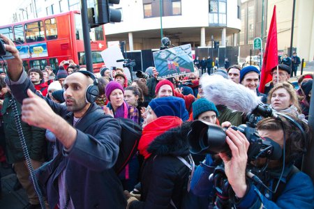 Photo for UNITED-KINGDOM, London: Members of the 'Plane Stupid' group addresses to demonstrators as protesters gather at Willesden Magistrates Court on February 24, 2016 in London - Royalty Free Image